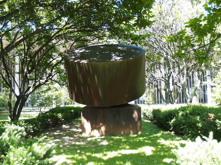 Rusty can welded steel art object under
      the magnolias by the Earth Science building
