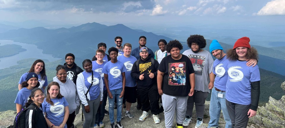 A group of students and counselors from the 2023 UAlbany Weather, Climate, and Chemistry Camp at the summit of Whiteface Mountain, NY.